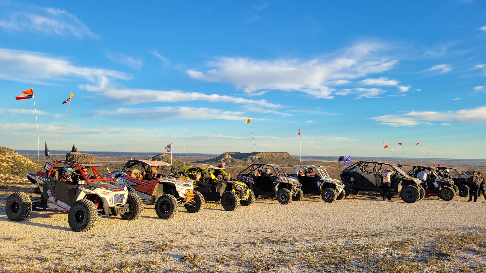 Side-by-side riders gathered while planning an off-road ride
